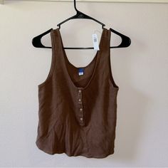 This Old Navy Tank Top Size Small Comes In A Waffle Knit Print With Buttons Down The Front. New With Tags Trendy Brown Cotton Tank Top, Summer Brown Cotton Tank Top, Brown Cotton Tank Top For Day Out, Brown Cotton Summer Tank Top, Stretch V-neck Brown Tank Top, Denim Tank, Old Navy Tank Tops, Long Sleeve Workout, Active Tank Tops