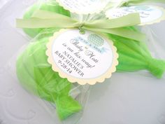 some green leaves wrapped in cellophane and tied with a ribbon on a white plate