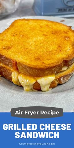 grilled cheese sandwich on a plate with text overlay reading air fryer recipe grilled cheese sandwich