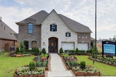 a large home with landscaping in front of it and a sign for westin real estate