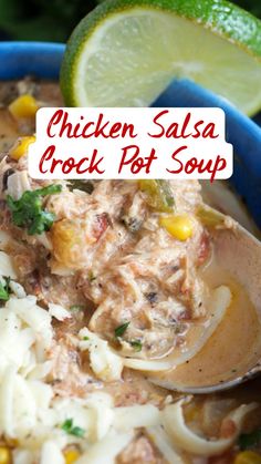 chicken salsa crock pot soup in a blue bowl with a lime wedge on the side