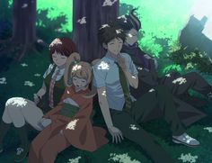 three people sitting in the grass next to a tree