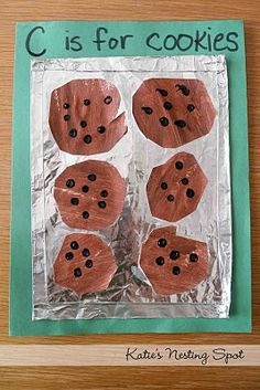 a paper plate with cookies on it and the words c is for cookies written in black