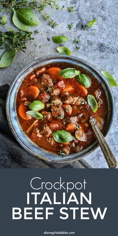 a bowl of crockpot italian beef stew with fresh herbs and basil on the side