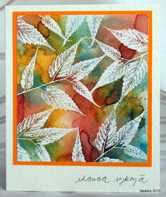 a card with leaves painted on it