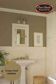 a bathroom with a tub, sink and mirror