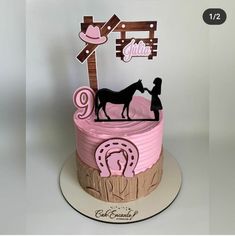 a pink and brown birthday cake with a horse on the top is for a girl