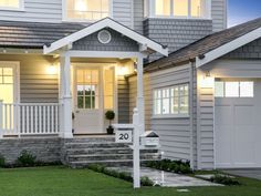 a house that is lit up at night with the number 30 on it's front porch