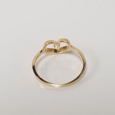 "Thanks for shopping our vintage estate store. We tend to sell well below wholesale and truly hope you enjoy all of our items. Many of the items are one of a kind, so please enjoy scrolling through the pictures and hopefully something will catch your eye. Brown spots are from camera. Estate 10k yellow gold .02ct cz diamond heart baby ring. Ring size: 2 CZ Diamond: .02ct Inside ring: 13.3mm Setting: 6mm 1/4\" Band width: 1.5mm Weight: .64 gram Very sweet ring. Marked 10k." Baby Ring, Heart Band, Sweet Ring, Baby Rings, Baby Baptism, Brown Spots, Filigree Ring, Cz Diamond, Ring Ring