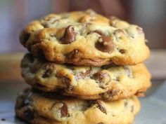 three chocolate chip cookies stacked on top of each other