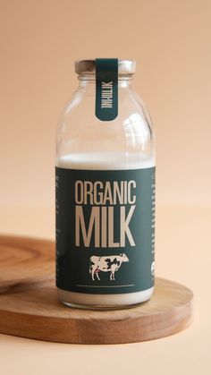 a glass jar filled with milk sitting on top of a wooden tray