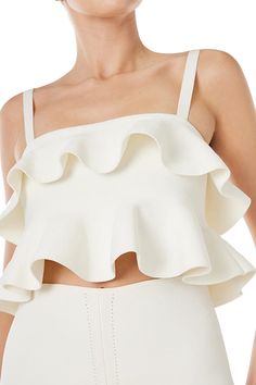 Monique Lhuillier white knit ruffle top with spaghetti straps and back gold zipper. Chic Spring Knit Top With Ruffles, Luxury Ruffled Crop Top For Summer, Elegant Spring Ruffle Knit Top, Chic White Knit Top With Ruffles, Luxury Cropped Ruffle Tops, Ruffle Blouse Designs, Bridal Wardrobe, Pretty Top, Monique Lhuillier