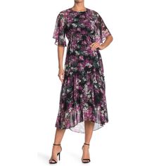 New With Tag Taylor Dresses Floral Print Dress Color: Multi (Black And Purple) Size: 12 Approx Measurements Laying Flat Armpit To Armpit: 19” Waist: 16” Front Length: 48” Back Length: 55” Sleeve Length: 17” (At Longest Spot) Floral Print Jewel Neck Short Sleeves Back Zip Closure Allover Floral Print P8-21 4-22 1 Sh. Purple Short Sleeve Midi Dress With Ruffles, Purple Midi Dress With Short Sleeves And Ruffles, Purple Floral Print Short Sleeve Midi Dress, Flowy Ruffle Dress, Black Ruffled Dress, Faux Skirt, Cold Shoulder Sweater Dress, Funky Dresses, Lace Trim Blouse