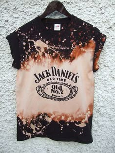 a t - shirt that has been dyed black and orange with the words jack daniels on it