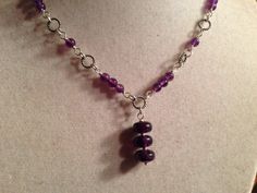 This amethyst necklace is made of purple amethyst gemstones, sterling silver: chain, spring ring clasp and findings. This necklace measures 18 inches in length and the pendant measures about 3/4 inch. All of our jewelry is unique and custom designed. Most of our jewelry can easily be resized. If there is a piece of jewelry that you are interested in, but would like some changes made, please do not hesitate to contact us. All of our jewelry arrives wrapped and ready for giving! We appreciate your Amethyst Pendant Jewelry With Adjustable Chain, Elegant Purple Necklace With Lobster Clasp, Purple Gemstone Bead Pendant Jewelry, Purple Pendant Jewelry With Gemstone Beads, Amethyst Gemstone Bead Pendant Jewelry, Purple Amethyst Wire Wrapped Necklaces, Elegant Amethyst Wire Wrapped Necklaces, Purple Sterling Silver Necklace With Adjustable Chain, Elegant Wire Wrapped Amethyst Necklace