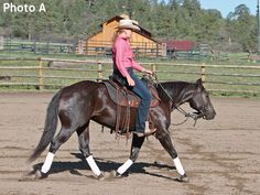 a woman riding on the back of a brown horse