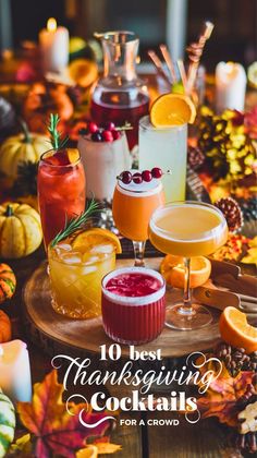 thanksgiving cocktails on a table with candles and autumn leaves