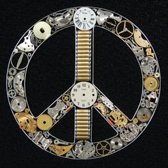 a peace sign made out of assorted watch parts