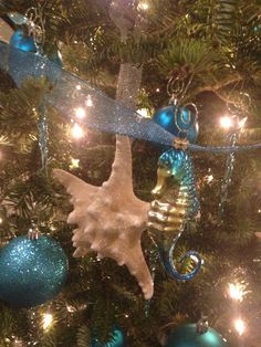 a christmas tree with ornaments hanging from it