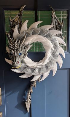 a dragon wreath hanging on the front door