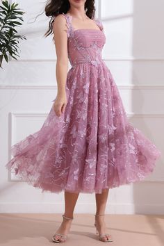 This midi dress features a stunning corset design with 3D butterflies and delicate straps. Crafted from a soft dusty pink fabric, it's both stylish and comfortable. Perfect for a romantic date night or a special occasion, this dress will make you feel confident and beautiful. Bust and Skirt with full lining. 100% Polyester 100% Recycled polyester lining Concealed zip at center back Imported Dusty Pink Fabric, Patterned Bridesmaid, Corset Design, Tea Length Dress, Romantic Date Night, Pink Tea, Romantic Date, 3d Butterflies, Dress Dusty