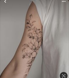 a person with a flower tattoo on their arm