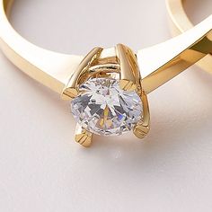 Solitaire Ring 10k 14k 18K Solid Gold/ Special Design Gold Engagement Ring For Her / Handmade Solitaire Fine Jewelry / A+ Cubic Zirconia / Nature Friendly Gift Package 💎 Stone Shape: Round 💎 Stone Cut: Brilliant 💎 Stone Color: DEF Grade 💎 Stone Clarity: VS1 - VVS 💎 Stone Size: 5mm A solitaire ring refers to any piece of jewelry with a single gemstone. A+ cubic zirconia solitaire rings have come to mark some of the most significant occasions in one's life, like sweet-sixteen, anniversaries, and the most notable, an engagement proposal. Traditionally, the solitaire symbolizes the commitment and fidelity between a couple. For this reason, it has become greatly associated with engagements and commitment rings. If you do want to incorporate a solitaire into your wedding  you may get it as 14k Gold Brilliant Cut Crystal Promise Ring, Gold Open Ring Diamond Couple Rings, Gold Open Diamond Couple Rings, Elegant Gold Couple Rings With Cubic Zirconia, Elegant Gold Cubic Zirconia Couple Rings, Luxury Gold Crystal Ring, Gold Solitaire Open Ring Jewelry, Gold Round Crystal Promise Ring, Gift Ring With Single Diamond In Cubic Zirconia