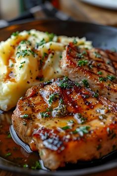 some meat and mashed potatoes on a plate