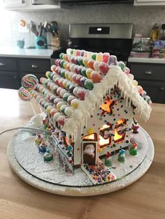 a gingerbread house is decorated with candy and candies