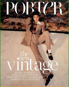 a magazine cover with a woman laying on the floor wearing a suit and hat,