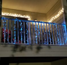 a balcony with blue lights on the balconies