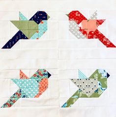 four different birds made out of fabric on top of each other, with one bird in the middle