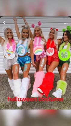 four women dressed up in costume posing for a photo with the caption halloween costumes