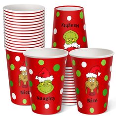 red christmas cups with green polka dots and cartoon characters on them, all decorated in santa's hats