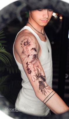 a man with a tattoo on his arm