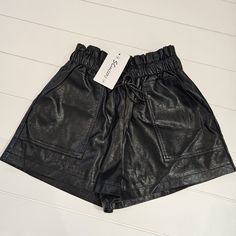 Faux Leather Shorts Size Small Material: Faux Pu Leather (Soft And Comfortable). No Stretchy Fabric, Only Elastic Waist Design: Elastic Waist, Wide Leg, Front Real Pockets, Back False Pockets, Abover Knee, Soft Lining. Occasion: Casual Outtings, School, Dates, Beach And Parties. Easy To Be Paired With Any Tops, Such As Pullover, Blouses, Or A Simple T-Shirt. Leather Shorts Women, Faux Leather Shorts, Simple T Shirt, Simple Tshirt, Shorts Women, Leather Shorts, Leather Women, Dates, Pu Leather