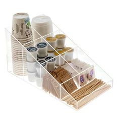 a clear plastic container filled with lots of different types of paper cups and sauces