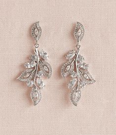 "These earrings have been designed by me! I've created these beautiful earrings and bracelet using crystals set in romantic and flowing leaf style settings Total length of earrings: Just under 2 1/4\" Widest portion 7/8\" wide Crystal focal measures 2\" long and just under 1 1/4\" wide. Matching Hair Combs: https://www.etsy.com/listing/192217610/rose-gold-hair-comb-bridal-hair-comb https://www.etsy.com/listing/198668893/bridal-hair-comb-vintage-style-hair-comb https://www.etsy.com/listing/261086 Delicate Wedding Necklace, Rose Gold Earrings Wedding, Bridal Backdrop Necklace, Teardrop Pearl Earrings, Long Bridal Earrings, Rose Gold Bridal Earrings, Gold Leaf Necklace, Backdrops Necklace, Crystal Earrings Wedding