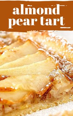 a close up of food on a plate with the words almond pear tart