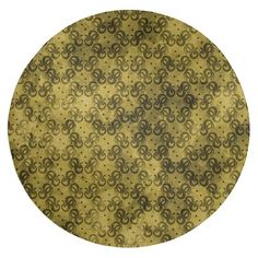 a round gold and black pattern on a white background