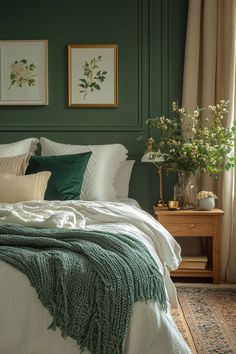 a bedroom with green walls and white linens on the bed, along with plants