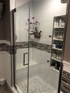 a walk in shower sitting next to a bathroom sink