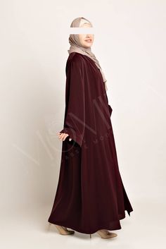 Elevate your elegance with our luxurious 2-piece abaya set in a stunning burgundy hue, designed for the modern woman who appreciates style and comfort. Made from premium nida fabric, this exquisite ensemble features a slight stretch and a beautiful sheen that catches the light perfectly. The sleeveless inner dress with a convenient back zip closure provides a flattering fit, while the open front outer piece drapes gracefully for a silhouette that exudes sophistication. Enjoy wudhu-friendly sleev Elegant Dabka Maxi Dress, Elegant Maxi Dress With Dabka, Elegant Red Abaya With Dabka Detailing, Elegant Red Floor-length Abaya, Elegant Floor-length Solid Abaya, Elegant Dabka Khimar, Burgundy Abaya, Front Open Abaya, Hijab Colors