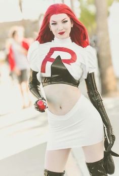 a woman with red hair and black gloves is posing for the camera in a white outfit