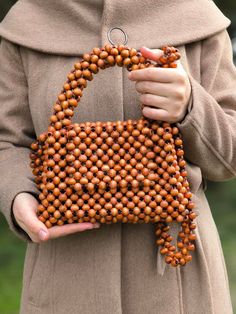 Payment is paid by the buyer. This handcrafted brown knitted beaded bag is a unique piece designed to complement your bohemian style. Meticulously crafted with attention to detail, this bag offers a perfect blend of ethnic vibes and natural elegance. More than just an accessory, this bag is a work of art. The brown knitted texture adds a touch of natural sophistication and warmth, while the beaded details provide it with a dazzling shine and elegance. Handcrafted with each bead meticulously plac Knitted Texture, Bead Bag, Wooden Bag, Knitting Bag, Bag Stand, Beaded Bag, Beaded Handbag, Color Complement, Handmade Bag