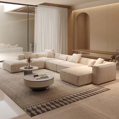 a modern living room with white furniture and large windows