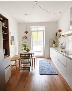 the kitchen is clean and ready to be used for dinner or lunchtime, with plenty of natural light