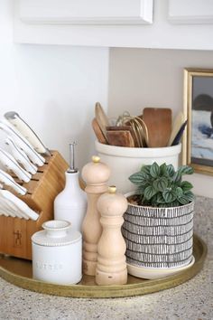 kitchen utensils are arranged on a tray