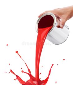 a person pouring red liquid into a can