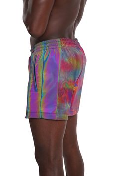 Mens rainbow holographic festival shorts with a liner? Hell yeah! These amazing mens drawstring shorts will keep everything secure while you get down on the dance floor! They also have plenty of zipper pockets to stash your festival essentials and are available without the lining if you prefer. FEATURES: Three zipper pockets: Two on the sides and one at the back Exterior made with our mind bending rainbow holographic four-way stretch Techno Color spandex Contrast rainbow reflective side panel th Multicolor Short Rave Bottoms, Rave Bottoms With Built-in Shorts, Rainbow Shorts, Gloves Dress, Rainbow Holographic, Festival Essentials, Festival Shorts, On The Dance Floor, Hell Yeah